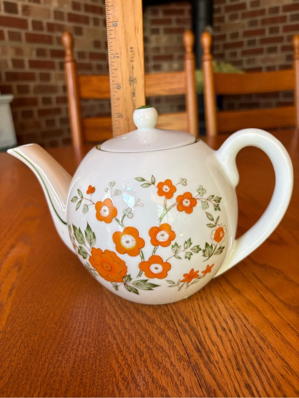 White Ceramic Teapot with Orange Floral Pattern